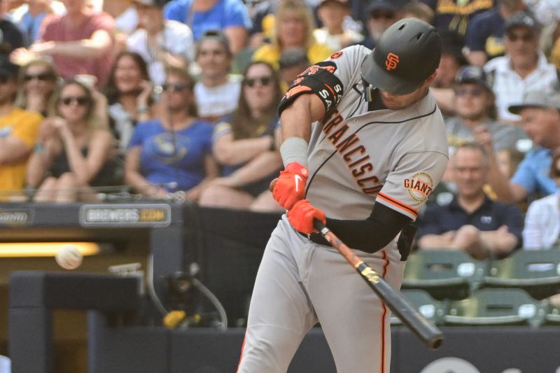 May 28, 2023; Milwaukee, Wisconsin, USA;  San Francisco Giants catcher Blake Sabol (2) hits a three-run home run against the Milwaukee Brewers in the seventh inning at American Family Field. Mandatory Credit: Benny Sieu-USA TODAY Sports