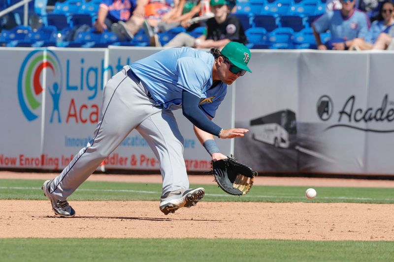 Mar 17, 2025; Port St. Lucie, Florida, USA;  Tampa Bay Rays first baseman Bob Seymour fields a ground ball during the ninth inning against the New York Mets at Clover Park. Mandatory Credit: Reinhold Matay-Imagn Images. 