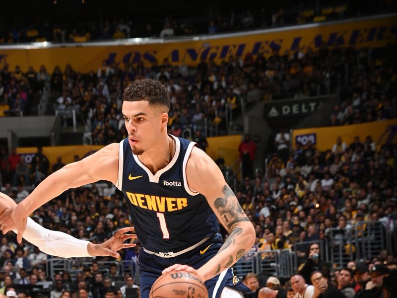 LOS ANGELES, CA - APRIL 27: Michael Porter Jr. #1 of the Denver Nuggets dribbles the ball during the game against the Los Angeles Lakers during Round 1 Game 4 of the 2024 NBA Playoffs on April 27, 2024 at Crypto.Com Arena in Los Angeles, California. NOTE TO USER: User expressly acknowledges and agrees that, by downloading and/or using this Photograph, user is consenting to the terms and conditions of the Getty Images License Agreement. Mandatory Copyright Notice: Copyright 2024 NBAE (Photo by Andrew D. Bernstein/NBAE via Getty Images)