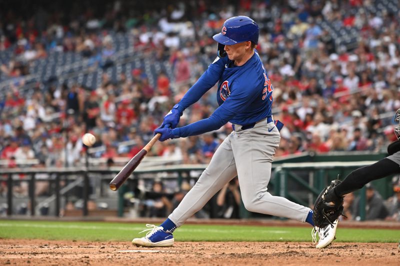 Aug 31, 2024; Washington, District of Columbia, USA; Chicago Cubs center fielder Pete Crow-Armstrong (52) hits the ball into play against the Washington Nationals during the seventh inning at Nationals Park. Mandatory Credit: Rafael Suanes-USA TODAY Sports