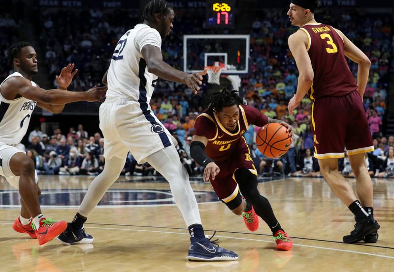 Jan 27, 2024; University Park, Pennsylvania, USA; Minnesota Golden Gophers guard Elijah Hawkins (0) dribbles the ball around Penn State Nittany Lions forward Qudus Wahab (22) and guard Kanye Clary (0) during the second half at Bryce Jordan Center. Minnesota defeated Penn State 83-74. Mandatory Credit: Matthew O'Haren-USA TODAY Sports