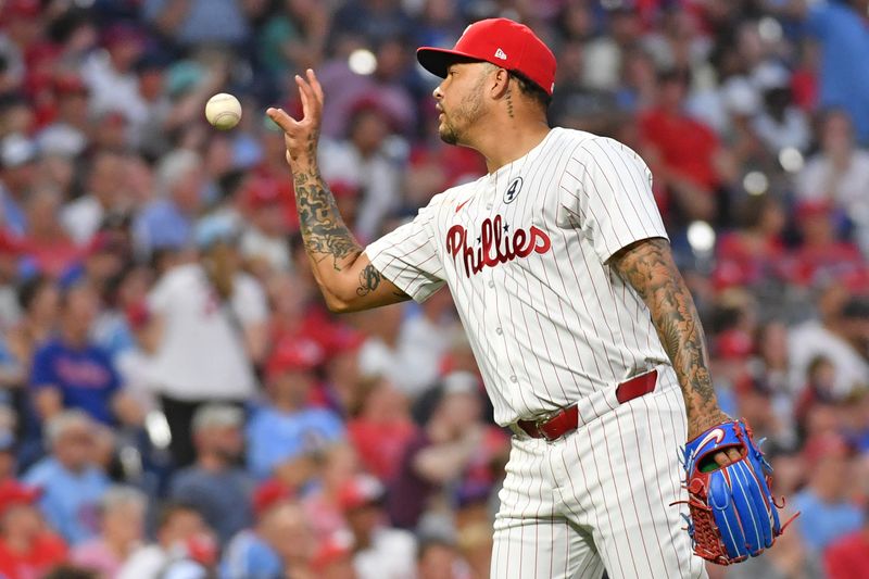 Jun 2, 2024; Philadelphia, Pennsylvania, USA;  Philadelphia Phillies pitcher Taijuan Walker (99) gets a new baseball after allowing a home run against the St. Louis Cardinals during the third inning at Citizens Bank Park. Mandatory Credit: Eric Hartline-USA TODAY Sports