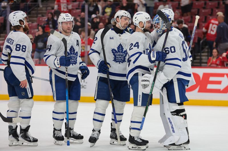 Dec 2, 2025; Sunrise, Florida, USA; Toronto Maple Leafs center Scott Laughton (24) celebrates with goaltender Joseph Woll (60) after the game against the Florida Panthers at Amerant Bank Arena. Mandatory Credit: Sam Navarro-Imagn Images
