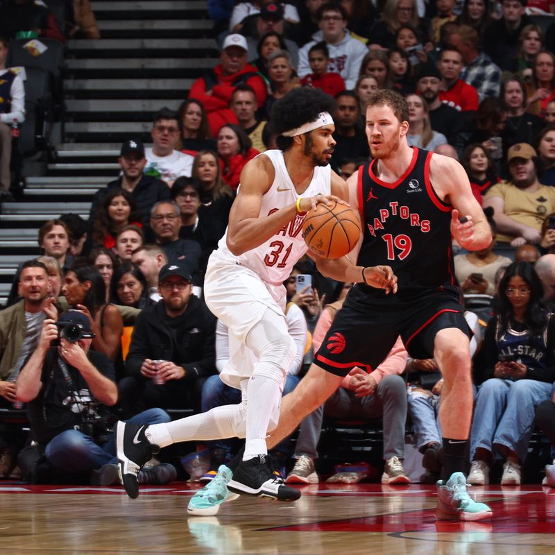 TORONTO, CANADA - FEBRUARY 10: Jarrett Allen #31 of the Cleveland Cavaliers dribbles the ball during the game against the Toronto Raptors on February 10, 2024 at the Scotiabank Arena in Toronto, Ontario, Canada.  NOTE TO USER: User expressly acknowledges and agrees that, by downloading and or using this Photograph, user is consenting to the terms and conditions of the Getty Images License Agreement.  Mandatory Copyright Notice: Copyright 2024 NBAE (Photo by Vaughn Ridley/NBAE via Getty Images)