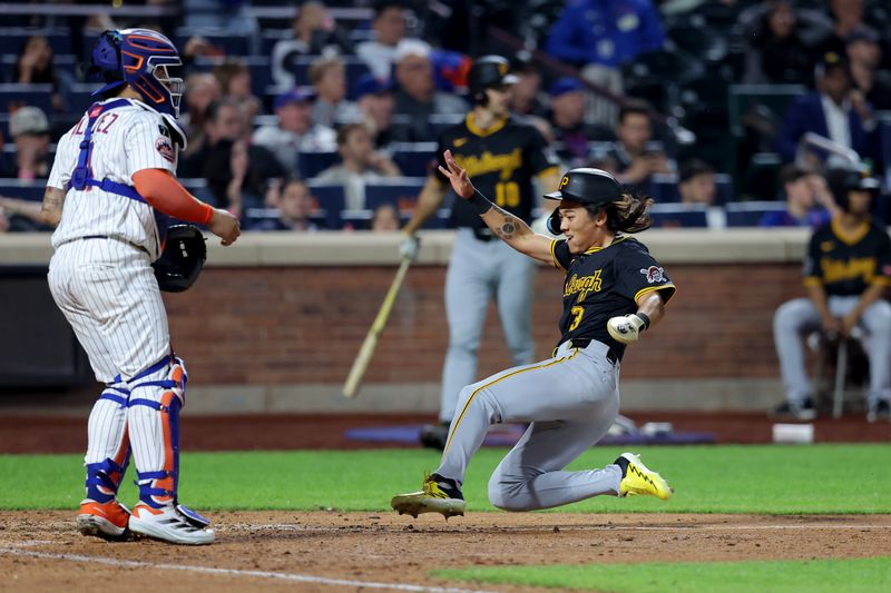 May 12, 2025; New York City, New York, USA; Pittsburgh Pirates pinch runner Ji Hwan Bae (3) scores a run against New York Mets catcher Francisco Alvarez (4) during the ninth inning at Citi Field. Mandatory Credit: Brad Penner-Imagn Images