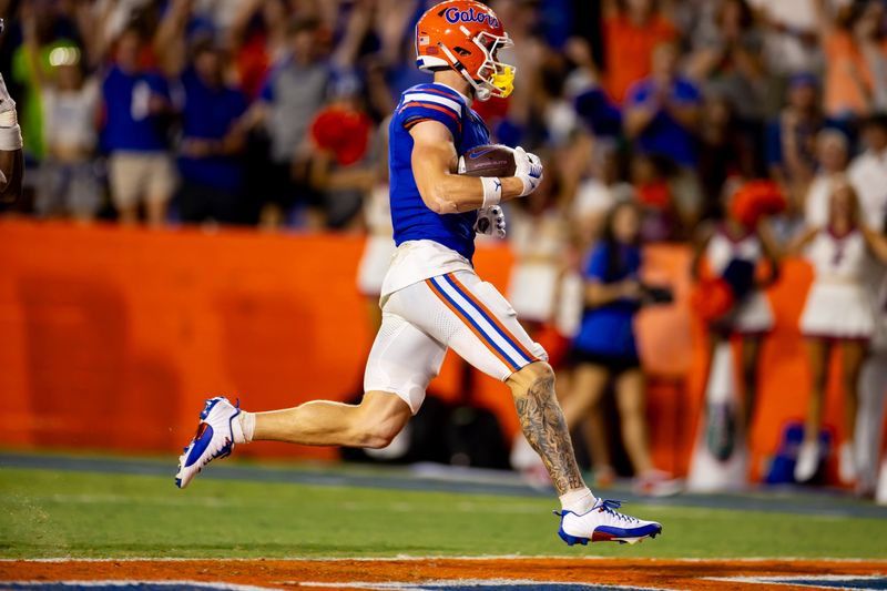 Sep 9, 2023; Gainesville, Florida, USA; Florida Gators wide receiver Ricky Pearsall (1) scores a touchdown during the second half against the McNeese State Cowboys at Ben Hill Griffin Stadium. Mandatory Credit: Matt Pendleton-USA TODAY Sports