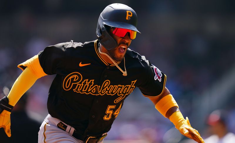 Sep 10, 2023; Cumberland, Georgia, USA; Pittsburgh Pirates right fielder Joshua Palacios (54) runs to third base on a triple against the Atlanta Braves during the seventh inning at Truist Park. Mandatory Credit: John David Mercer-USA TODAY Sports