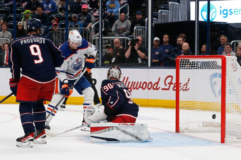 Oct 28, 2024; Columbus, Ohio, USA; The shot from Edmonton Oilers defenseman Mattias Ekholm (14) (not pictured) beats Columbus Blue Jackets goalie Elvis Merzlikins (90) for a goal during the third period at Nationwide Arena. Mandatory Credit: Russell LaBounty-Imagn Images