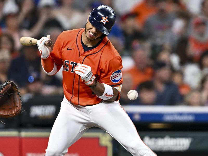 Jun 27, 2025; Houston, Texas, USA; Houston Astros shortstop Jeremy Pena (3) hit by a pitch in the second inning against the Chicago Cubs at Daikin Park. Mandatory Credit: Maria Lysaker-Imagn Images 