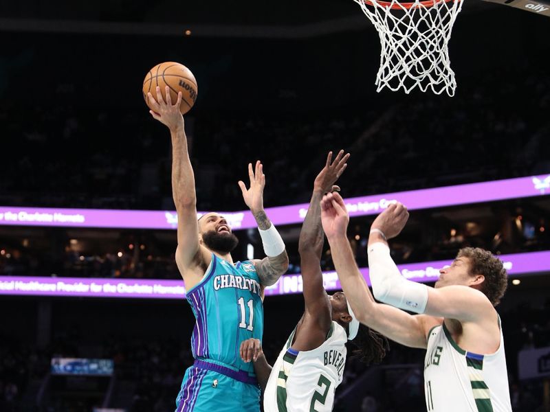 CHARLOTTE, NC - FEBRUARY 29: Cody Martin #11 of the Charlotte Hornets drives to the basket during the game against the Milwaukee Bucks on February 29, 2024 at Spectrum Center in Charlotte, North Carolina. NOTE TO USER: User expressly acknowledges and agrees that, by downloading and or using this photograph, User is consenting to the terms and conditions of the Getty Images License Agreement.  Mandatory Copyright Notice:  Copyright 2024 NBAE (Photo by Brock Williams-Smith/NBAE via Getty Images)