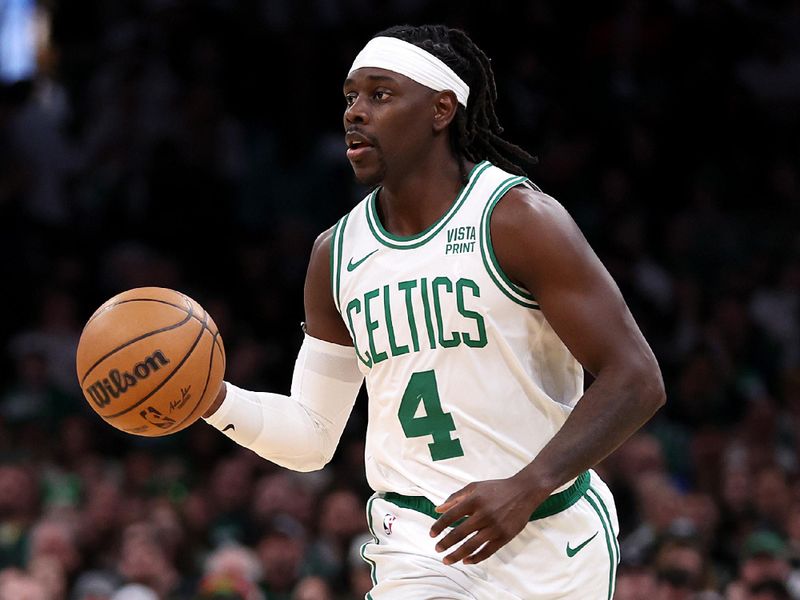 BOSTON, MASSACHUSETTS - JANUARY 05: Jrue Holiday #4 of the Boston Celtics dribbles downcourt during the second quarter against the Utah Jazz at TD Garden on January 05, 2024 in Boston, Massachusetts. NOTE TO USER: User expressly acknowledges and agrees that, by downloading and or using this photograph, user is consenting to the terms and conditions of the Getty Images License Agreement.  (Photo by Maddie Meyer/Getty Images)