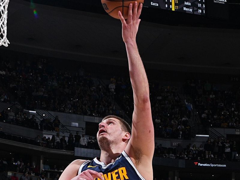 DENVER, CO - APRIL 10: Nikola Jokic #15 of the Denver Nuggets drives to the basket during the game against the Minnesota Timberwolves on April 10, 2024 at the Ball Arena in Denver, Colorado. NOTE TO USER: User expressly acknowledges and agrees that, by downloading and/or using this Photograph, user is consenting to the terms and conditions of the Getty Images License Agreement. Mandatory Copyright Notice: Copyright 2024 NBAE (Photo by Garrett Ellwood/NBAE via Getty Images)