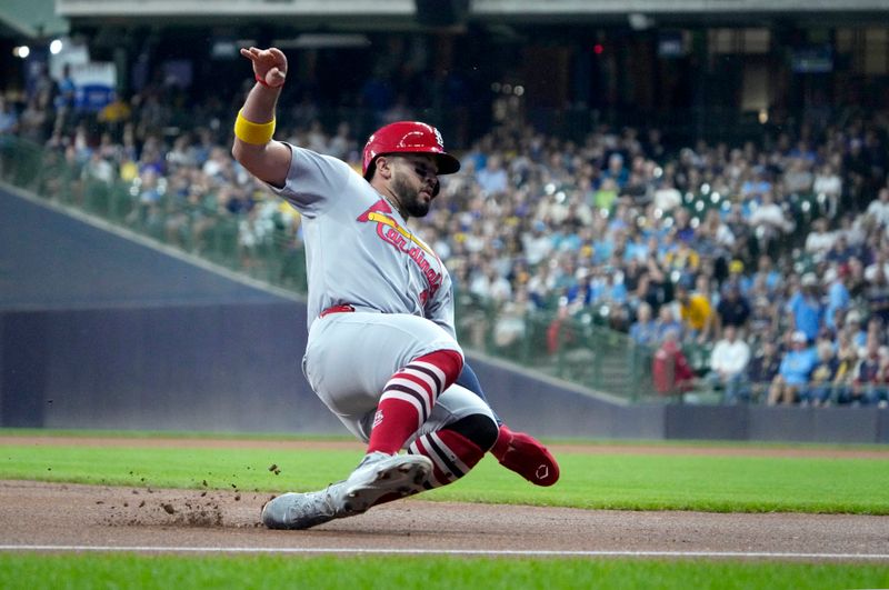 Sep 12, 2025; Milwaukee, Wisconsin, USA; St. Louis Cardinals catcher Ivan Herrera (48) slides safely into third base against the Milwaukee Brewers in the first innning at American Family Field. Mandatory Credit: Michael McLoone-Imagn Images