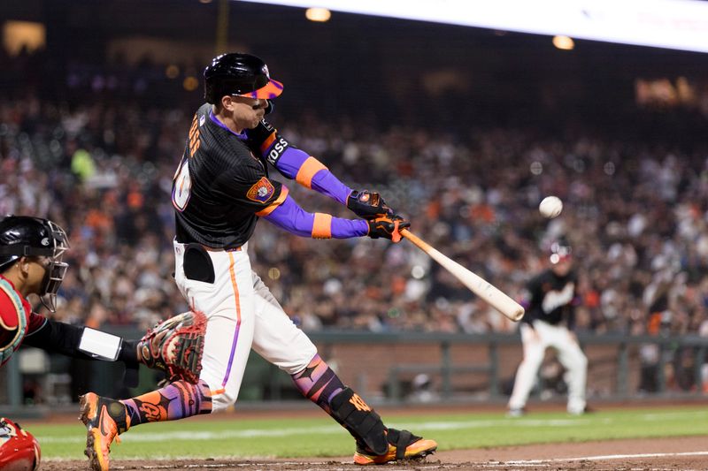 May 13, 2025; San Francisco, California, USA; San Francisco Giants second baseman Christian Koss (50) hits a single against the Arizona Diamondbacks during the fifth inning at Oracle Park. Mandatory Credit: John Hefti-Imagn Images