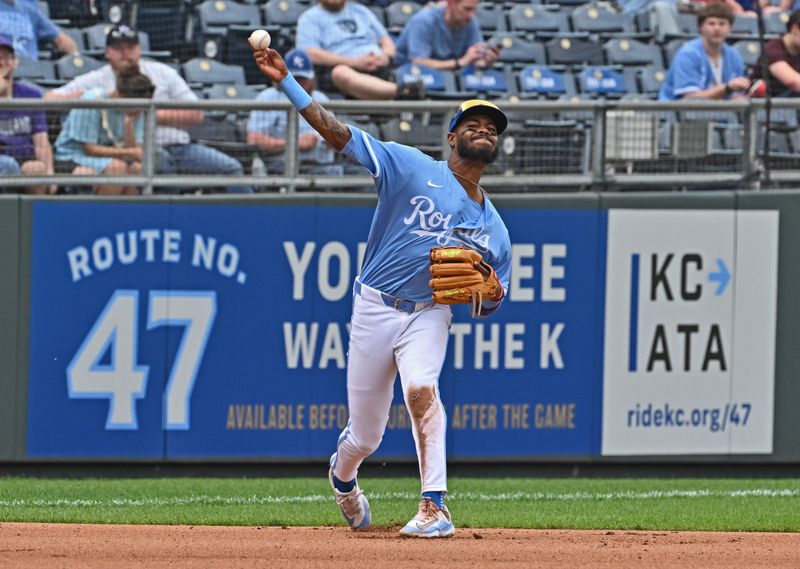 Apr 24, 2025; Kansas City, Missouri, USA;  Kansas City Royals third baseman Maikel Garcia (11) throws to first base for an out in the seventh inning against the Colorado Rockies at Kauffman Stadium. Mandatory Credit: Peter Aiken-Imagn Images