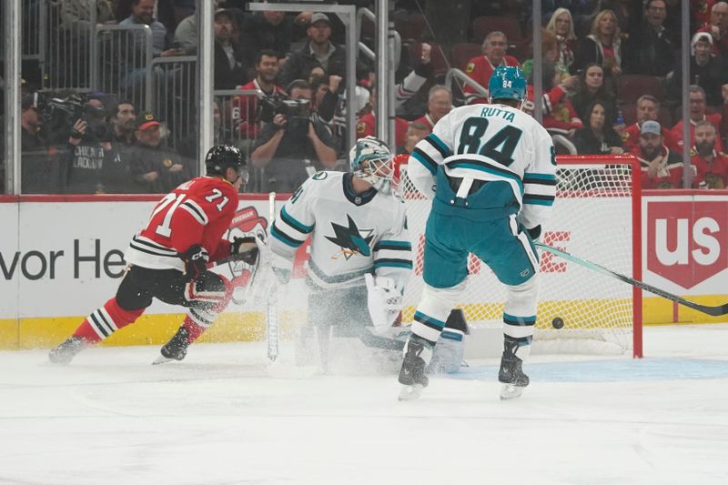 Oct 17, 2024; Chicago, Illinois, USA; Chicago Blackhawks left wing Taylor Hall (71) scores a goal on San Jose Sharks goaltender Vitek Vanecek (41) during the first period at United Center. Mandatory Credit: David Banks-Imagn Images