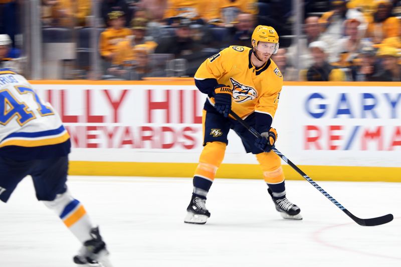 Apr 4, 2024; Nashville, Tennessee, USA; Nashville Predators center Gustav Nyquist (14) skates the puck toward the net during the third period against the St. Louis Blues at Bridgestone Arena. Mandatory Credit: Christopher Hanewinckel-USA TODAY Sports