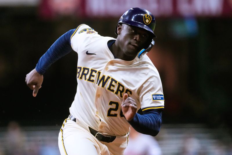 May 5, 2025; Milwaukee, Wisconsin, USA;  Milwaukee Brewers pinch runner Daz Cameron (20) rounds third base before scoring a run during the eighth inning against the Houston Astros at American Family Field. Mandatory Credit: Jeff Hanisch-Imagn Images