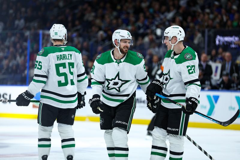 Nov 23, 2024; Tampa, Florida, USA; Dallas Stars center Tyler Seguin (91) talks to left wing Mason Marchment (27) against the Tampa Bay Lightning in the second period at Amalie Arena. Mandatory Credit: Nathan Ray Seebeck-Imagn Images