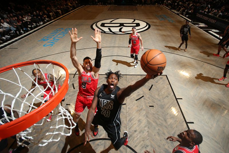 BROOKLYN, NY - MARCH 29: Dorian Finney-Smith #28 of the Brooklyn Nets drives to the basket during the game against the Chicago Bulls on March 29, 2024 at Barclays Center in Brooklyn, New York. NOTE TO USER: User expressly acknowledges and agrees that, by downloading and or using this Photograph, user is consenting to the terms and conditions of the Getty Images License Agreement. Mandatory Copyright Notice: Copyright 2024 NBAE (Photo by Nathaniel S. Butler/NBAE via Getty Images)