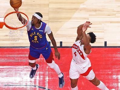 TORONTO, CANADA - DECEMBER 20: Kentavious Caldwell-Pope #5 of the Denver Nuggets drives to the basket during the game against the Toronto Raptors on December 20, 2023 at the Scotiabank Arena in Toronto, Ontario, Canada.  NOTE TO USER: User expressly acknowledges and agrees that, by downloading and or using this Photograph, user is consenting to the terms and conditions of the Getty Images License Agreement.  Mandatory Copyright Notice: Copyright 2023 NBAE (Photo by Vaughn Ridley/NBAE via Getty Images)