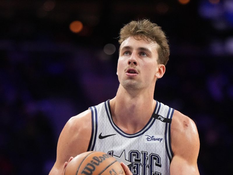 PHILADELPHIA, PA - DECEMBER 4: Franz Wagner #22 of the Orlando Magic shoots a free throw during the game against the Philadelphia 76ers on December 4, 2024 at the Wells Fargo Center in Philadelphia, Pennsylvania NOTE TO USER: User expressly acknowledges and agrees that, by downloading and/or using this Photograph, user is consenting to the terms and conditions of the Getty Images License Agreement. Mandatory Copyright Notice: Copyright 2024 NBAE (Photo by Jesse D. Garrabrant/NBAE via Getty Images)