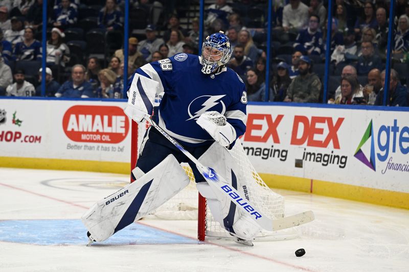 Dec 21, 2023; Tampa, Florida, USA; Tampa Bay Lightning goaltender Andrei Vasilevskiy (88) blocks a shot in the second period against the Las Vegas Golden Knights at Amalie Arena. Mandatory Credit: Jonathan Dyer-USA TODAY Sports