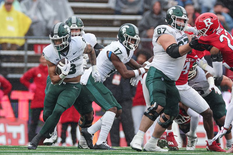 Oct 14, 2023; Piscataway, New Jersey, USA;  Michigan State Spartans running back Jalen Berger (8) carries the ball during the first half against the Rutgers Scarlet Knights at SHI Stadium. Mandatory Credit: Vincent Carchietta-USA TODAY Sports