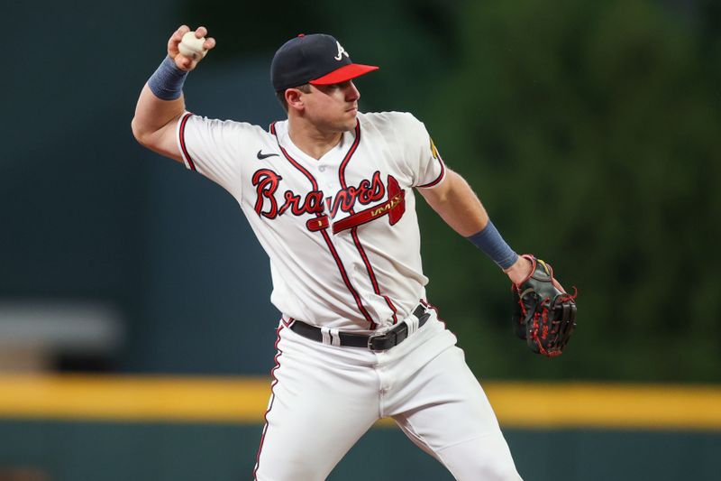 Aug 16, 2023; Atlanta, Georgia, USA; Atlanta Braves third baseman Austin Riley (27) throws a runner out at first against the New York Yankees in the ninth inning at Truist Park. Mandatory Credit: Brett Davis-USA TODAY Sports