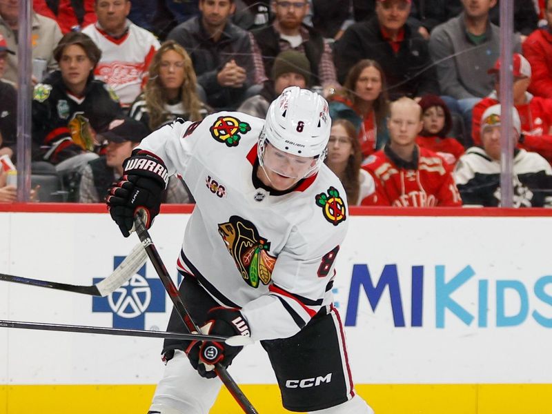Nov 9, 2025; Detroit, Michigan, USA; Chicago Blackhawks center Ryan Donato (8) handles the puck during the first period against the Detroit Red Wings at Little Caesars Arena. Mandatory Credit: Brian Bradshaw Sevald-Imagn Images