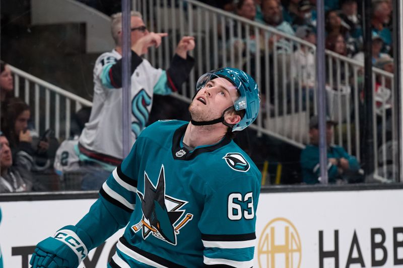 Apr 5, 2025; San Jose, California, USA; San Jose Sharks center Zack Ostapchuk (63) reacts after missing a shot on goal against the Seattle Kraken during the second period at SAP Center at San Jose. Mandatory Credit: Robert Edwards-Imagn Images