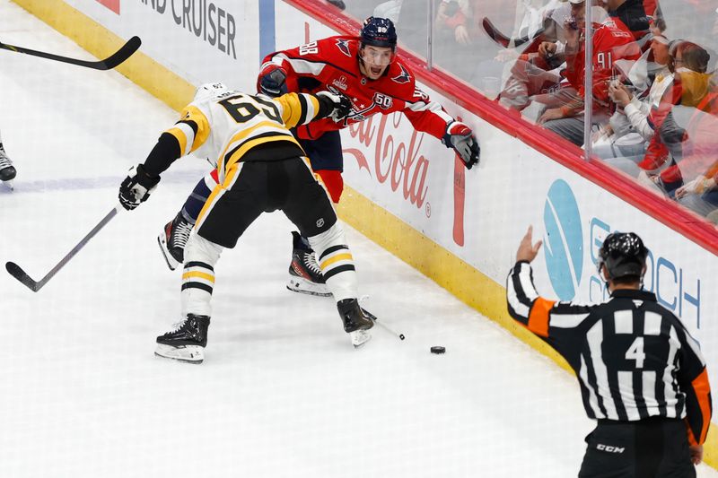 Nov 8, 2024; Washington, District of Columbia, USA; referee Wes McCauley (4) calls a penalty on Pittsburgh Penguins defenseman Erik Karlsson (65) as Washington Capitals left wing Andrew Mangiapane (88) yells in the first period at Capital One Arena. Mandatory Credit: Geoff Burke-Imagn Images