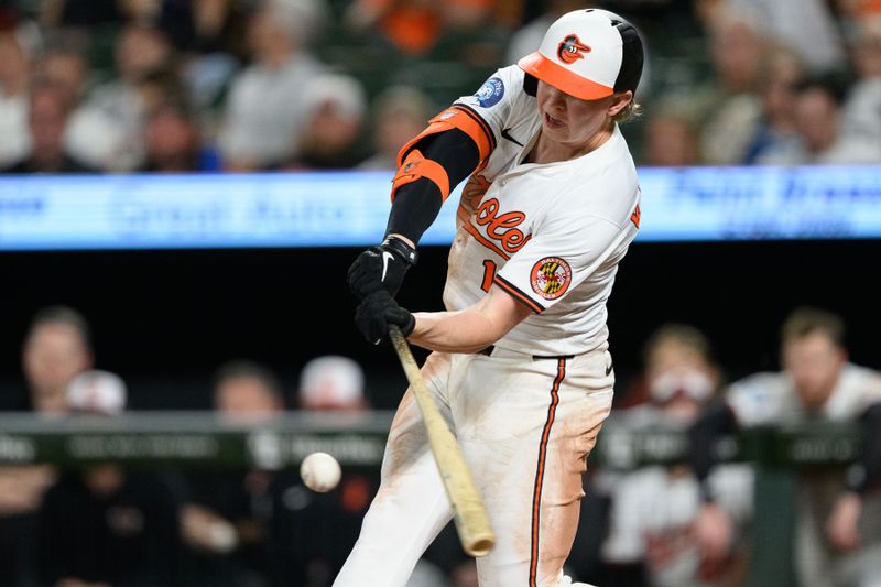 Apr 30, 2025; Baltimore, Maryland, USA; Baltimore Orioles outfielder Heston Kjerstad (13) hits a single during the eighth inning against the New York Yankees at Oriole Park at Camden Yards. Mandatory Credit: Reggie Hildred-Imagn Images