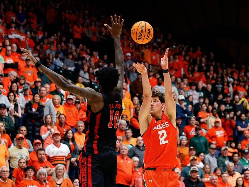 Jan 19, 2024; Fort Collins, Colorado, USA; Colorado State Rams forward Patrick Cartier (12) attempts a shot as UNLV Rebels forward Kalib Boone (10) defends in the second half at Moby Arena. Mandatory Credit: Isaiah J. Downing-USA TODAY Sports