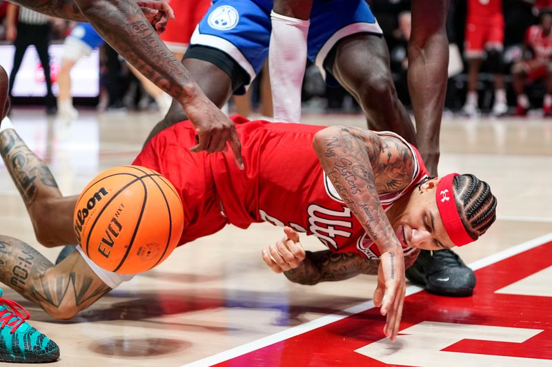 Jan 10, 2026; Salt Lake City, Utah, USA; Utah Utes guard Terrence Brown (2) keeps the ball inbounds during the second half against the BYU Cougars at Jon M. Huntsman Center. Mandatory Credit: Aaron Baker-Imagn Images