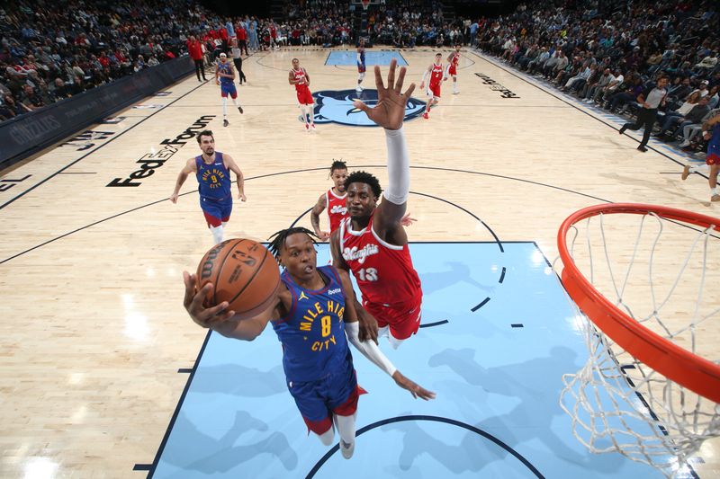 MEMPHIS, TN - NOVEMBER 17: Peyton Watson #8 of the Denver Nuggets drives to the basket during the game against the Memphis Grizzlies on November 17, 2024 at FedExForum in Memphis, Tennessee. NOTE TO USER: User expressly acknowledges and agrees that, by downloading and or using this photograph, User is consenting to the terms and conditions of the Getty Images License Agreement. Mandatory Copyright Notice: Copyright 2024 NBAE (Photo by Joe Murphy/NBAE via Getty Images)