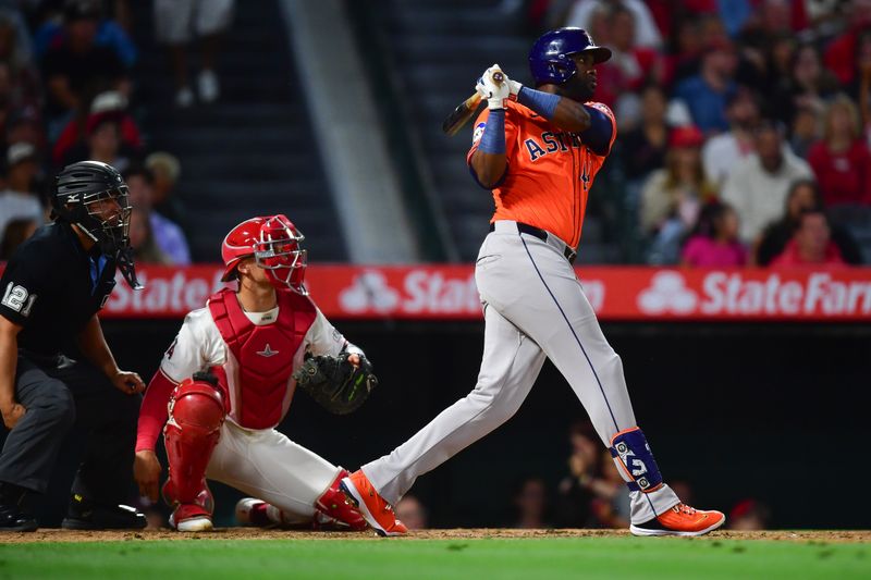 Jun 7, 2024; Anaheim, California, USA; Houston Astros outfielder Yordan Alvarez (44) hits a three run RBI double against the Los Angeles Angels during the seventh inning at Angel Stadium. Mandatory Credit: Gary A. Vasquez-USA TODAY Sports