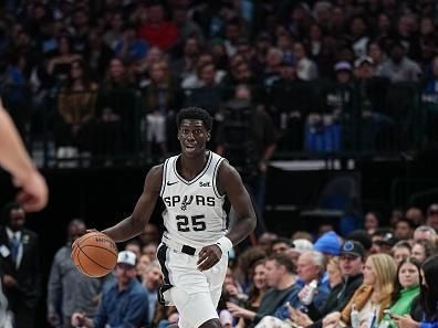 DALLAS, TX - DECEMBER 23: Sidy Cissoko #25 of the San Antonio Spurs dribbles the ball during the game against the Dallas Mavericks on December 23, 2023 at the American Airlines Center in Dallas, Texas. NOTE TO USER: User expressly acknowledges and agrees that, by downloading and or using this photograph, User is consenting to the terms and conditions of the Getty Images License Agreement. Mandatory Copyright Notice: Copyright 2023 NBAE (Photo by Glenn James/NBAE via Getty Images)