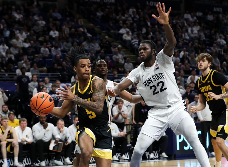 Feb 8, 2024; University Park, Pennsylvania, USA; Iowa Hawkeyes guard Dasonte Bowen (5) looks to pass the ball as Penn State Nittany Lions forward Qudus Wahab (22) defends during the second half at Bryce Jordan Center. Penn State defeated Iowa 89-79. Mandatory Credit: Matthew O'Haren-USA TODAY Sports