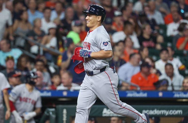 Aug 19, 2024; Houston, Texas, USA; Boston Red Sox pinch hitter Masataka Yoshida (7) smiles after hitting a home run during the sixth inning against the Houston Astros at Minute Maid Park. Mandatory Credit: Troy Taormina-USA TODAY Sports