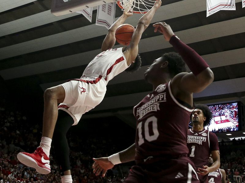 Feb 3, 2024; Tuscaloosa, Alabama, USA;  Alabama forward Mohamed Wague (11) dunks the ball against Mississippi State at Coleman Coliseum. Mandatory Credit: Gary Cosby Jr.-USA TODAY Sports