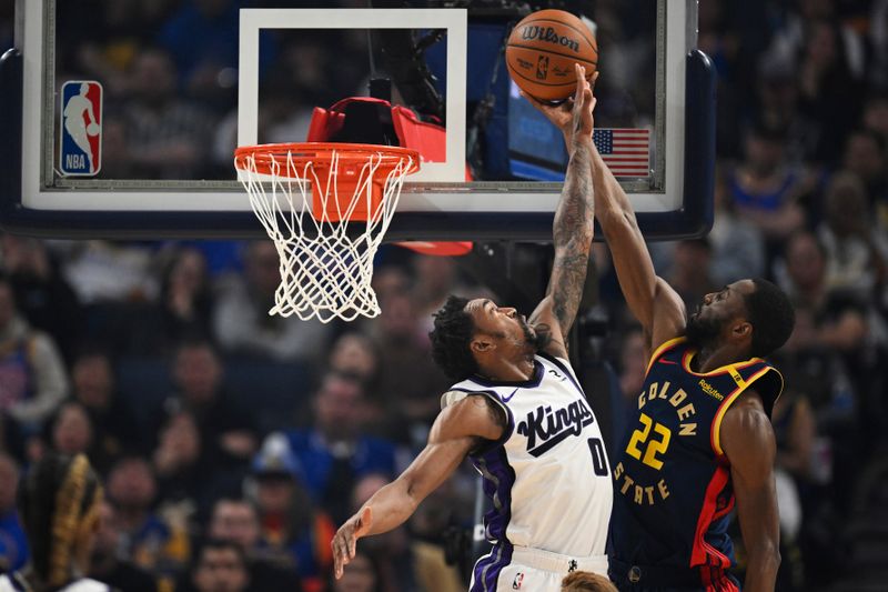 SAN FRANCISCO, CALIFORNIA - JANUARY 05: Andrew Wiggins #22 of the Golden State Warriors scores against Malik Monk #0 of the Sacramento Kings in the first quarter at Chase Center on January 05, 2025 in San Francisco, California. NOTE TO USER: User expressly acknowledges and agrees that, by downloading and or using this photograph, User is consenting to the terms and conditions of the Getty Images License Agreement. (Photo by Eakin Howard/Getty Images)