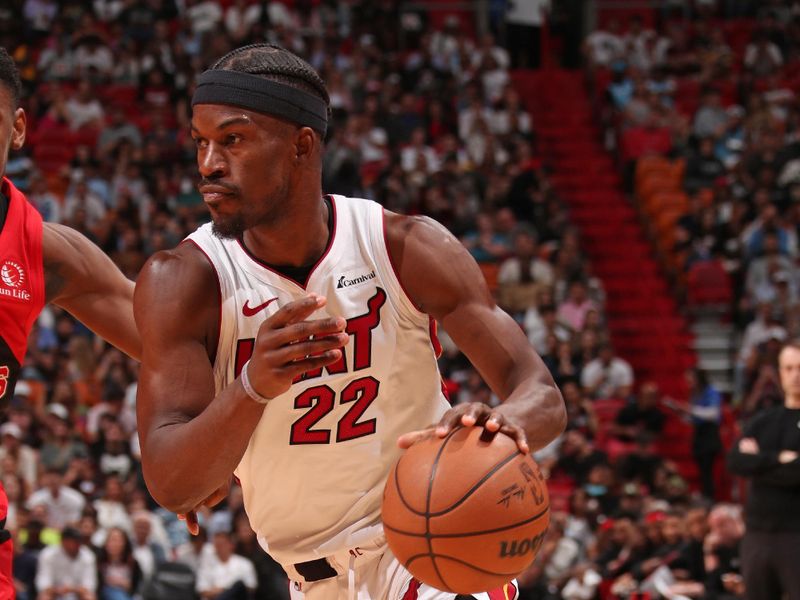 MIAMI, FL - APRIL 12:  Jimmy Butler #22 of the Miami Heat dribbles the ball during the game against the Toronto Raptors on April 12, 2024 at Kaseya Center in Miami, Florida. NOTE TO USER: User expressly acknowledges and agrees that, by downloading and or using this Photograph, user is consenting to the terms and conditions of the Getty Images License Agreement. Mandatory Copyright Notice: Copyright 2024 NBAE (Photo by Issac Baldizon/NBAE via Getty Images)