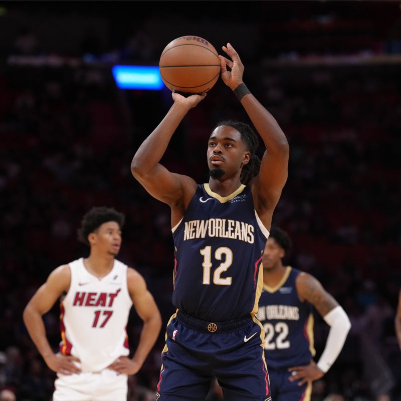 MIAMI, FL - OCTOBER 13: Antonio Reeves #12 of the New Orleans Pelicans shoots a free throw during the game against the Miami Heat  during a preseason game on October 13, 2024 at Kaseya Center in Miami, Florida. NOTE TO USER: User expressly acknowledges and agrees that, by downloading and or using this Photograph, user is consenting to the terms and conditions of the Getty Images License Agreement. Mandatory Copyright Notice: Copyright 2024 NBAE (Photo by Eric Espada/NBAE via Getty Images)