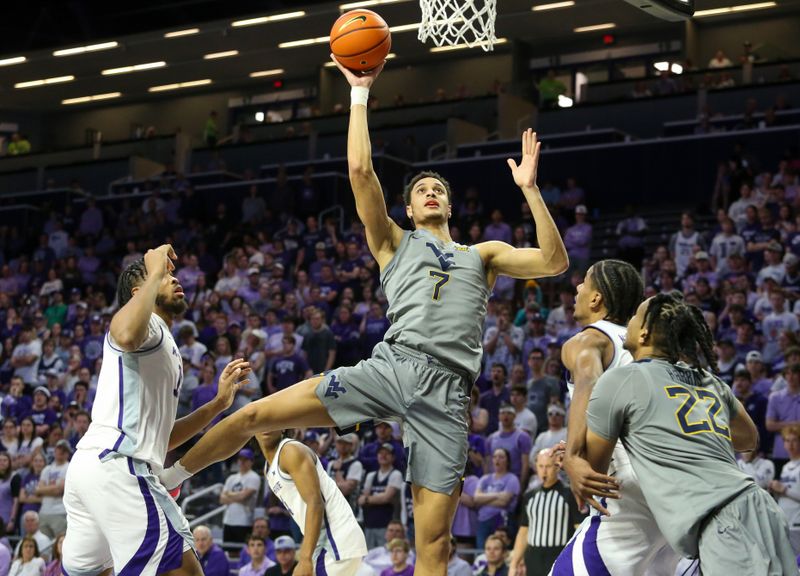 Feb 26, 2024; Manhattan, Kansas, USA; West Virginia Mountaineers center Jesse Edwards (7) shoots against Kansas State Wildcats center Will McNair Jr. (13) during the second half at Bramlage Coliseum. Mandatory Credit: Scott Sewell-USA TODAY Sports