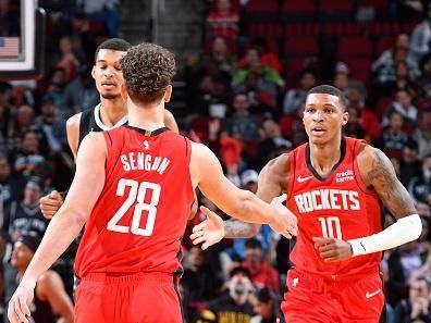 HOUSTON, TX - DECEMBER 11: Jabari Smith Jr. #10 of the Houston Rockets high fives Alperen Sengun #28 during the game against the San Antonio Spurs on December 11, 2023 at the Toyota Center in Houston, Texas. NOTE TO USER: User expressly acknowledges and agrees that, by downloading and or using this photograph, User is consenting to the terms and conditions of the Getty Images License Agreement. Mandatory Copyright Notice: Copyright 2023 NBAE (Photo by Logan Riely/NBAE via Getty Images)