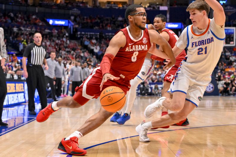 Mar 15, 2025; Nashville, TN, USA;  Alabama Crimson Tide guard Chris Youngblood (8) dribbles past Florida Gators forward Alex Condon (21) during the second half at Bridgestone Arena. Mandatory Credit: Steve Roberts-Imagn Images
