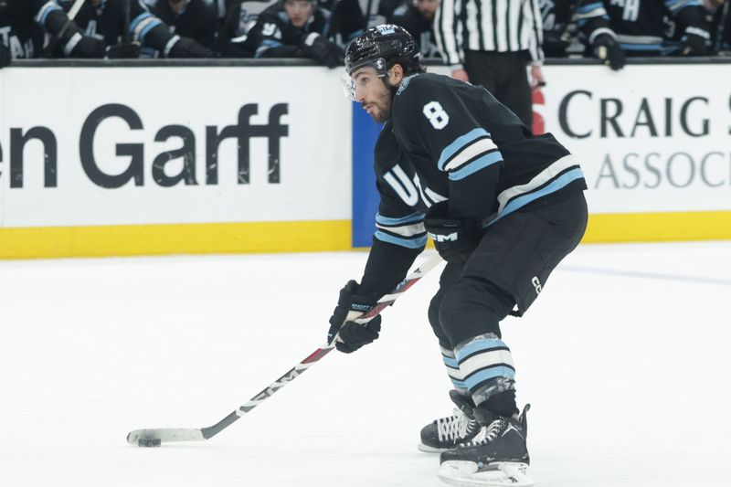 Jan 31, 2025; Salt Lake City, Utah, USA;  Utah Hockey Club center Nick Schmaltz (8) looks to shoot he puck against the Columbus Blue Jackets during the overtime period at Delta Center. Mandatory Credit: Chris Nicoll-Imagn Images