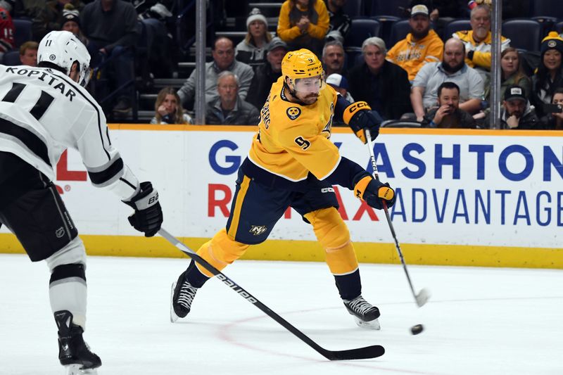 Jan 31, 2024; Nashville, Tennessee, USA; Nashville Predators left wing Filip Forsberg (9) shoots the puck during the third period against the Los Angeles Kings at Bridgestone Arena. Mandatory Credit: Christopher Hanewinckel-USA TODAY Sports