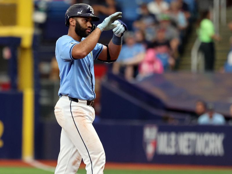 Jul 14, 2024; St. Petersburg, Florida, USA; Tampa Bay Rays outfielder Amed Rosario (10) celebrates after he singles against the Cleveland Guardians during the sixth inning  at Tropicana Field. Mandatory Credit: Kim Klement Neitzel-USA TODAY Sports